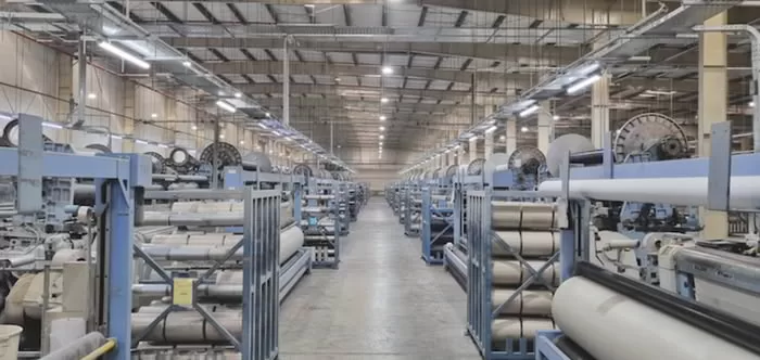 Floor Covering Weekly -Industry Overview & Key Trends Mattex Group Carpet Factory with textile machinery.